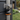 ABS padlock on a gate with a garden background