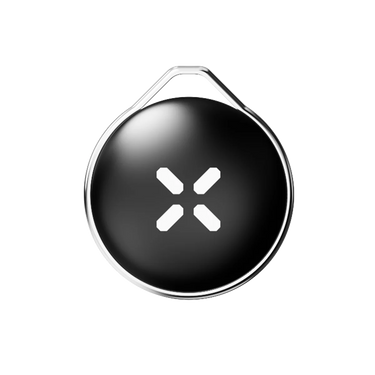 Black circular device with a white symbol on a white background