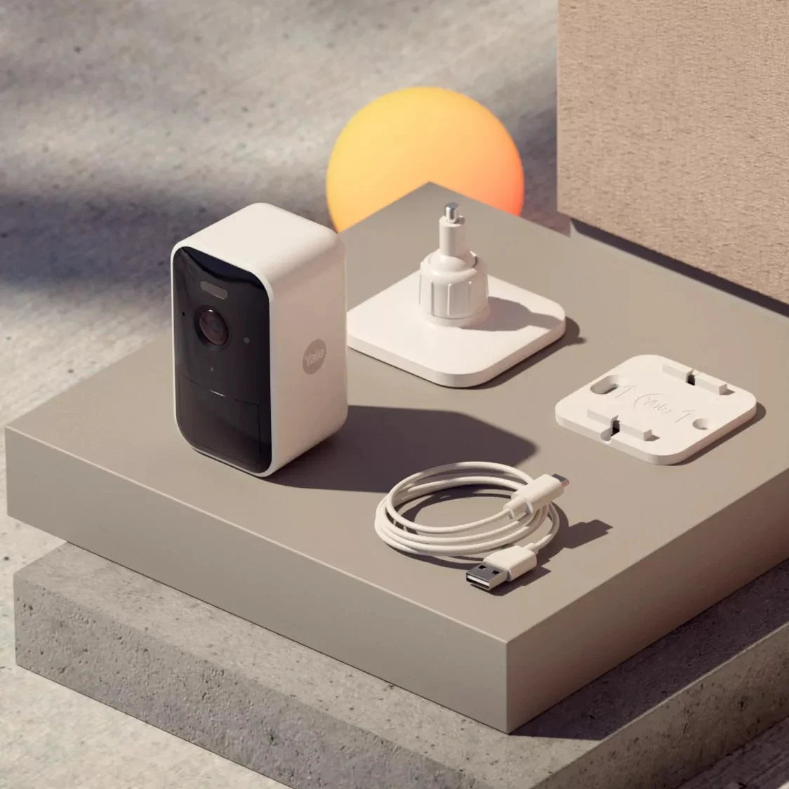 Yale Smart Outdoor Camera with included accessories and charging cable