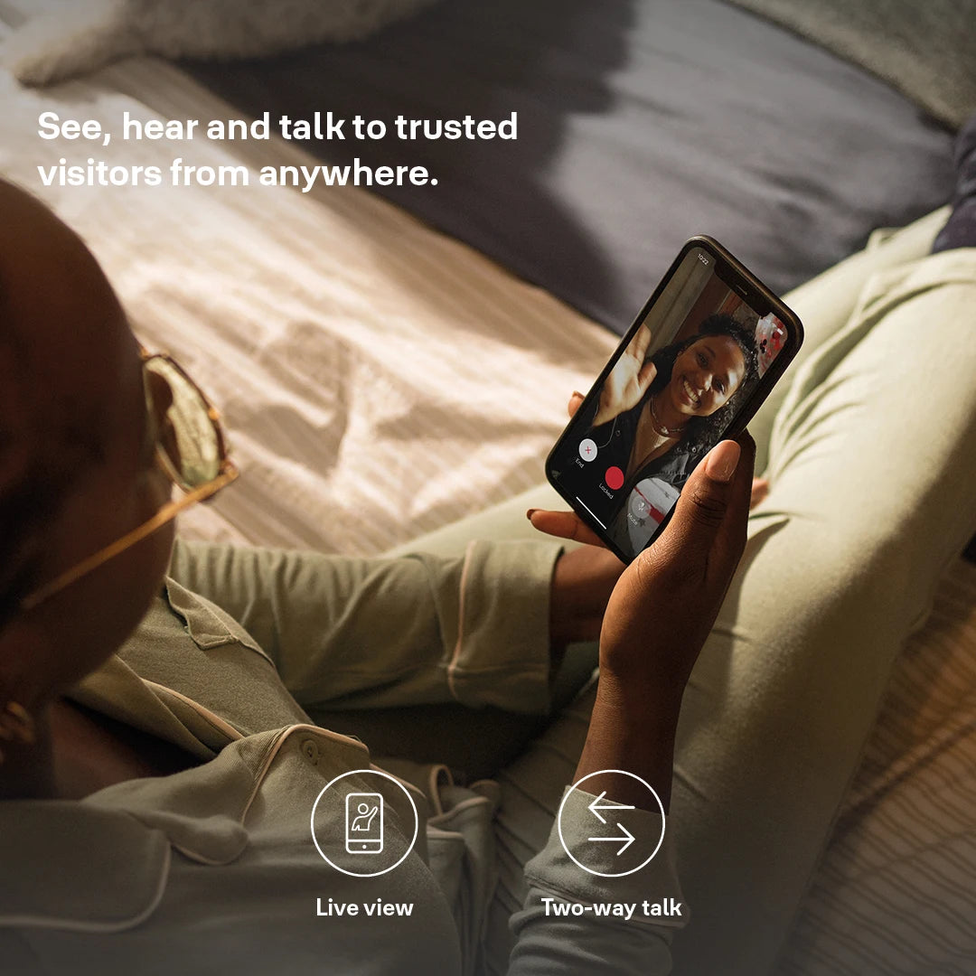 User speaking to visitor remotely using Yale Smart Video Doorbell live view and two-way talk