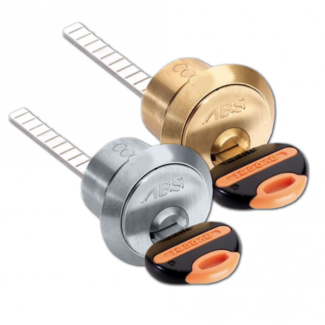 Two cylindrical door locks made of brass, one with a silver finish and the other with a gold finish, both marked with 'ABS', along with three keys, two with orange and one with black grip.