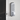 Digital mechanical door lock by Home Secure installed on a white door. The lock features a silver keypad with numbered push buttons (0–9) and a thumb turn at the bottom. The latch is visible on the door edge, aligned with the strike plate on the door frame