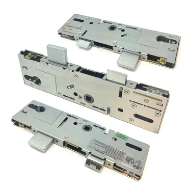 A set of metallic silver door lock center cases and gearboxes, displayed from different angles, showing the mechanism used in multipoint door locks.