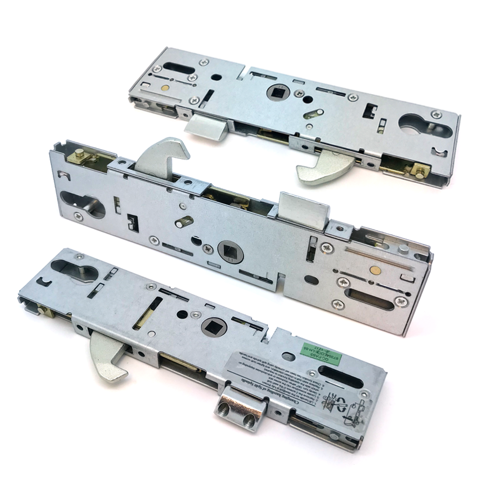 Three metal door lock center cases with gearboxes, displayed horizontally, with visible screws and mechanisms.