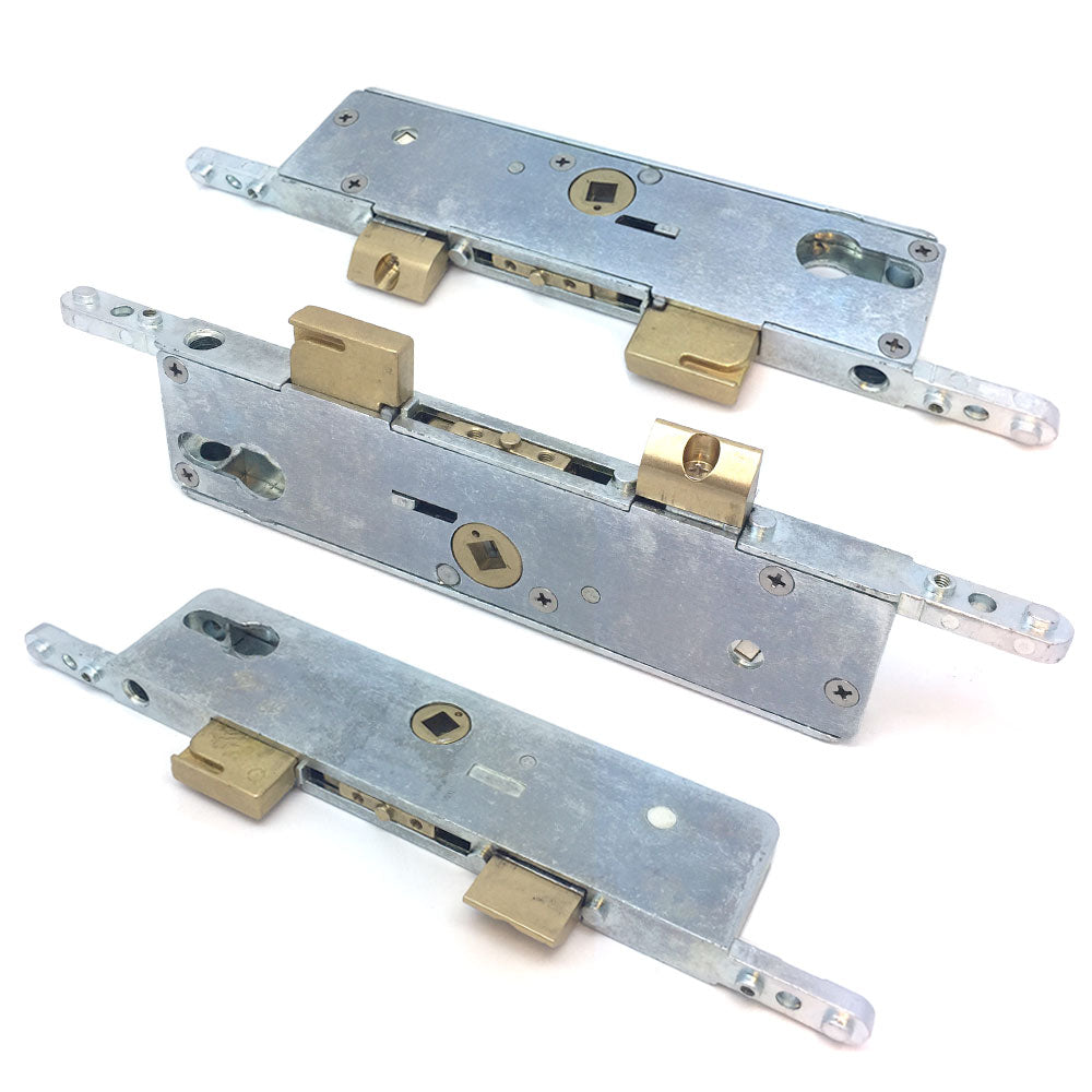 A set of metal door lock mechanisms, including cases and gearboxes, typically used in multipoint door locks.