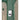 Polished chrome doorbell button mounted on a green door with decorative glass panels on either side.