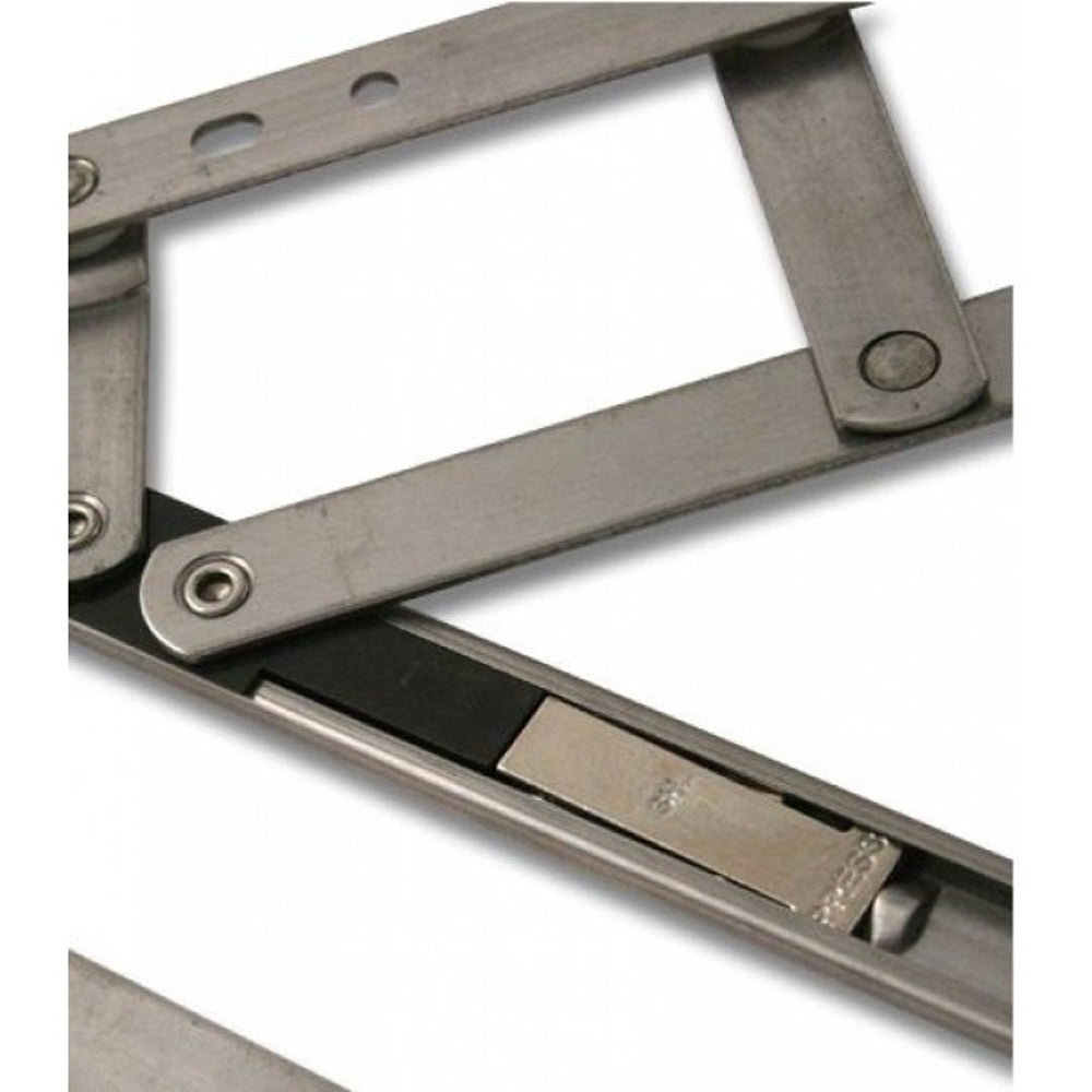 Close-up view of a security restricted window hinge (friction stay) in stainless steel, showing the pivoting arms and locking mechanism.