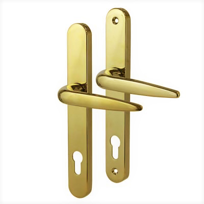 A pair of polished gold-colored door handles with elongated backplates. Each handle features a curved lever design and includes a euro-profile keyhole cutout.