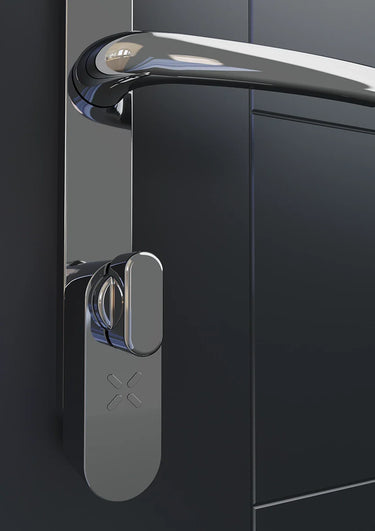 Chrome Black X smart lock fitted below a chrome lever handle on the inside of a dark grey door