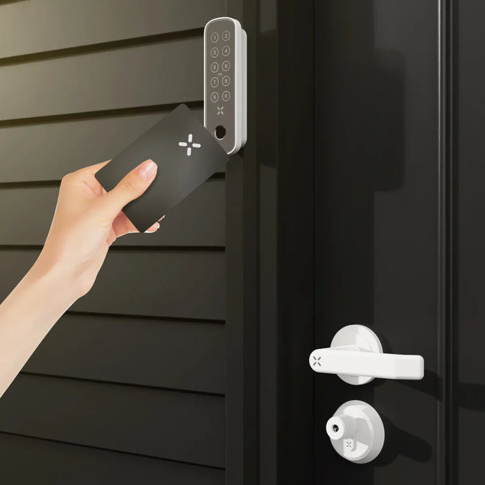 Hand holding a smartphone with a smart lock app, approaching a door with a digital lock.