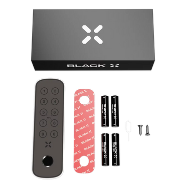 Black X product packaging with remote control, battery holder, and screws on a white background
