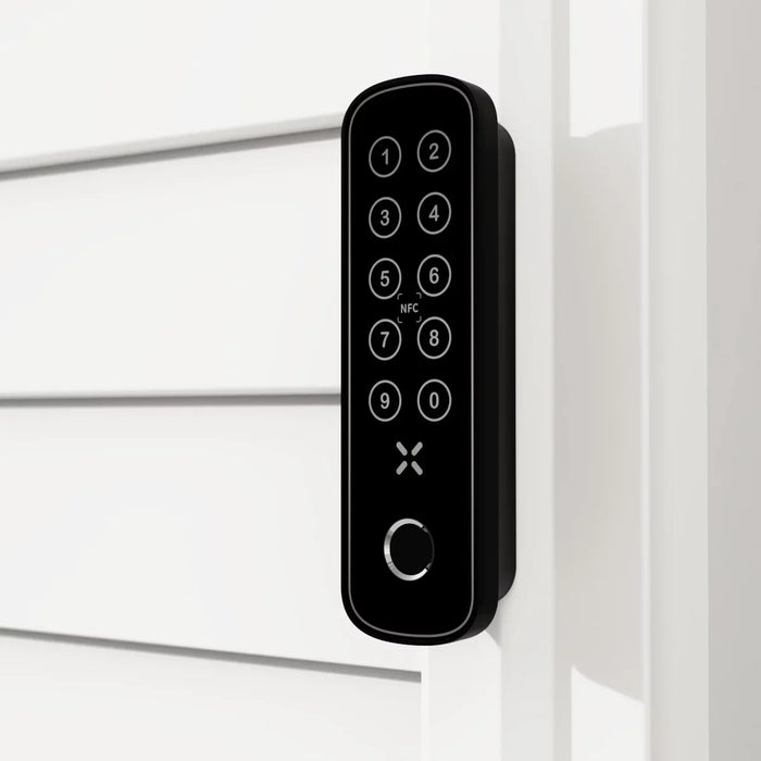 Digital keypad lock on a white door frame