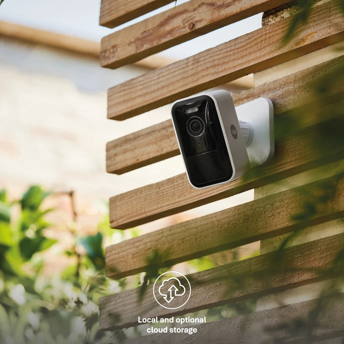 Yale Smart Outdoor Camera installed on exterior wooden wall for home monitoring