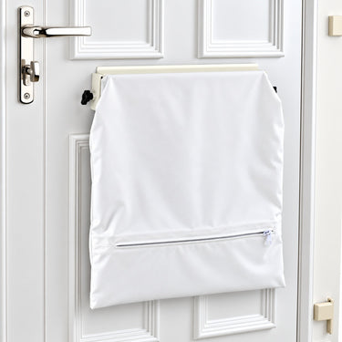 White fire retardant letterbox security bag fitted inside a front door, showing the discreet internal letterbox cover with zipped mail storage.