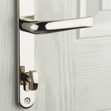 Yale Platinum Ultra thumb turn euro cylinder fitted on the inside of a white door, so you can lock and unlock without a key (handle shown fitted, not included)
