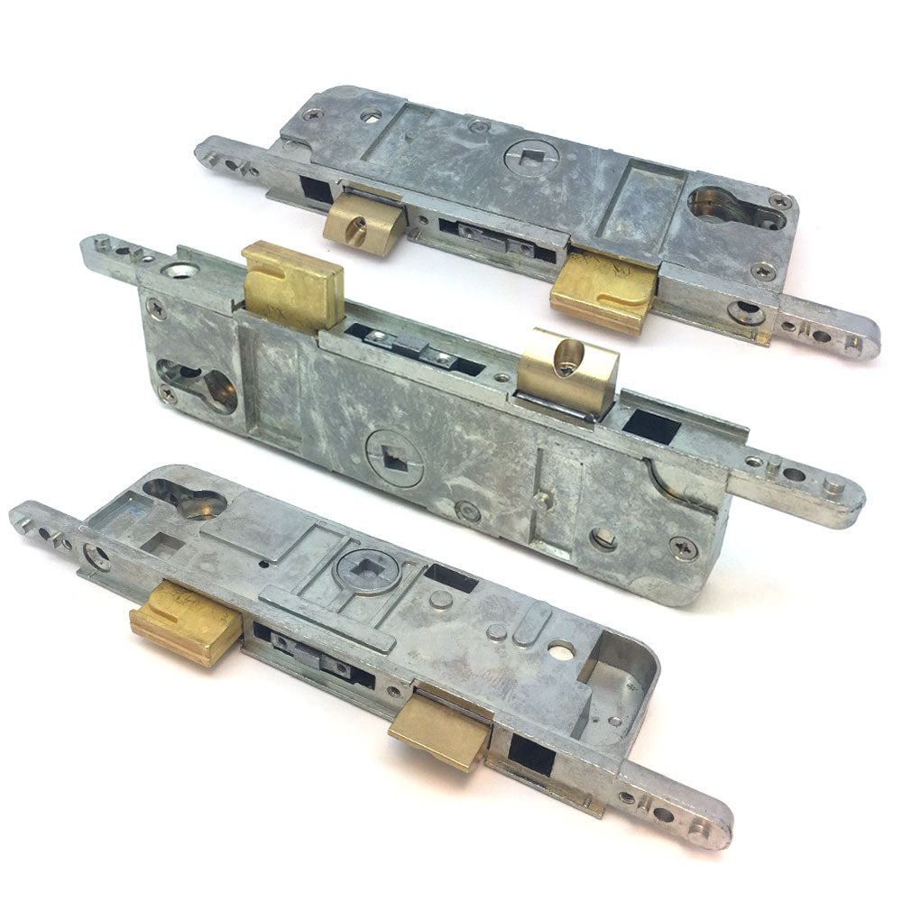 Three Fullex Type A door lock centre case gearboxes, shown from different angles, featuring robust metal construction and brass components for uPVC and composite doors.