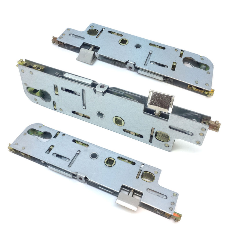 A set of metal door lock mechanisms, including a central case and spindle, typically used for multipoint door locks.