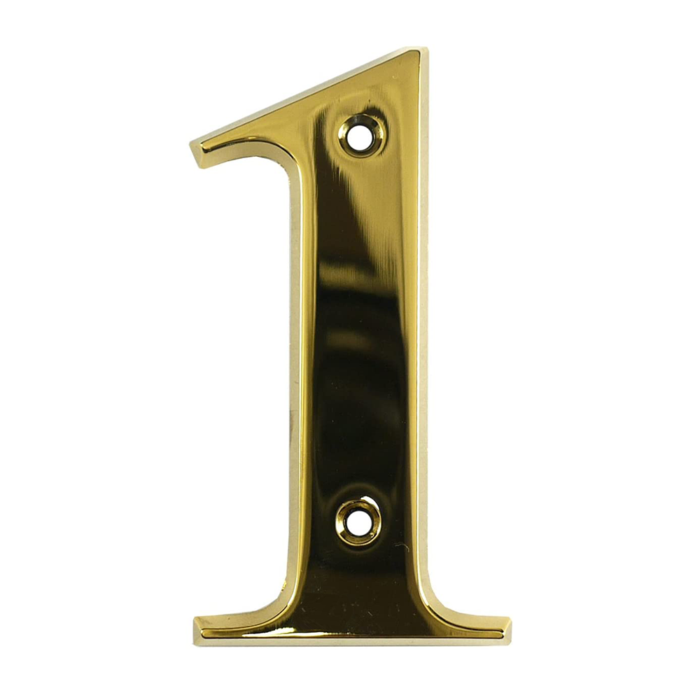 A gold-colored metal house number in the shape of the numeral 1.