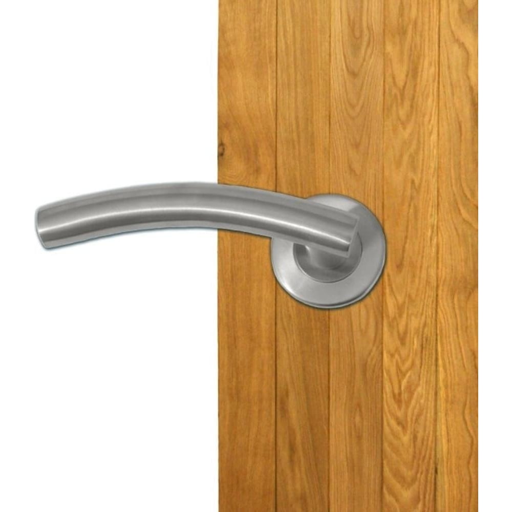 Sleek silver internal door handle installed on a wooden door.