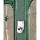 Polished chrome doorbell button mounted on a green door with decorative glass panels on either side.