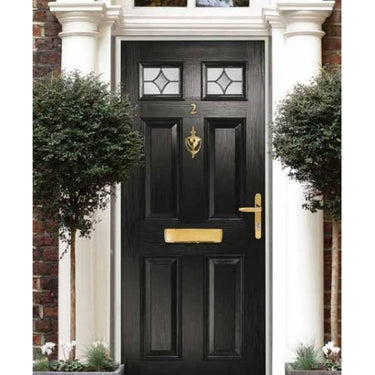 Black front door with gold door knocker, mail slot, and handle, flanked by two potted topiary trees, labeled "Premium Quality Door Knocker - Hoppe Complementary Range Victorian Urn.