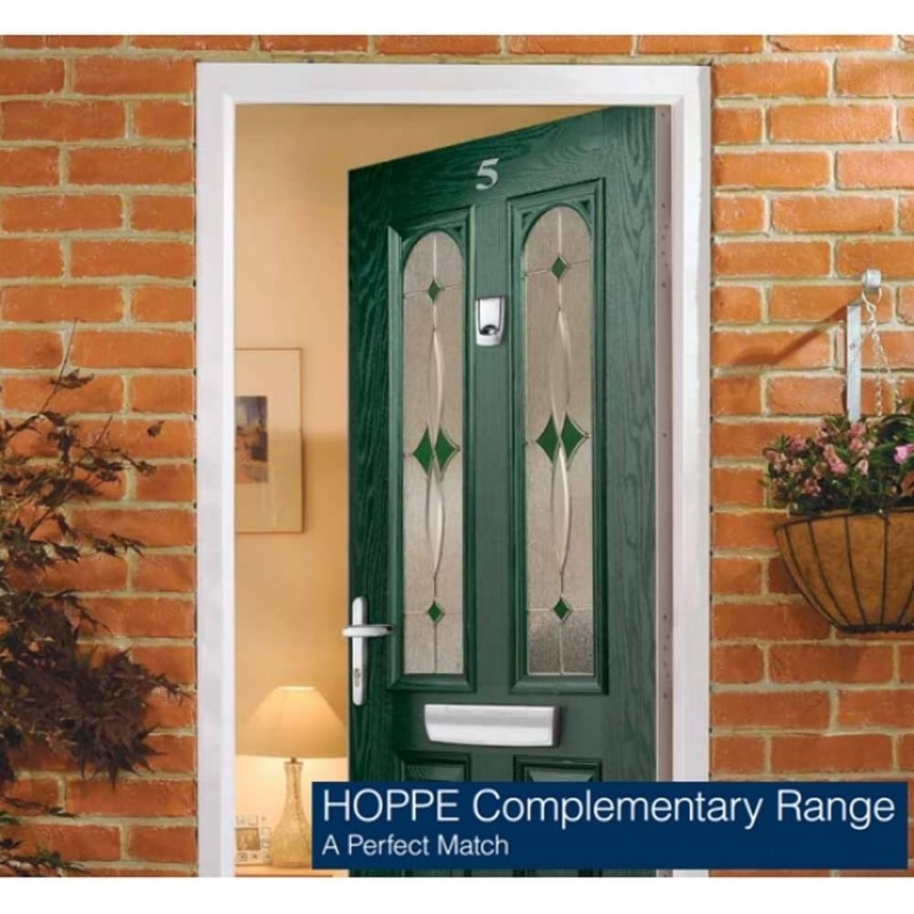 Green front door with decorative glass panels and white frame, featuring a silver letterplate, handle, and lock; text overlay reads "HOPPE Complementary Range A Perfect Match.