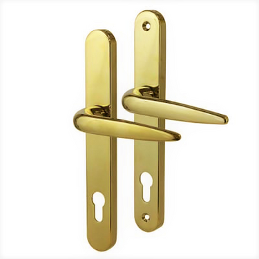 A pair of polished gold-colored door handles with elongated backplates. Each handle features a curved lever design and includes a euro-profile keyhole cutout. 