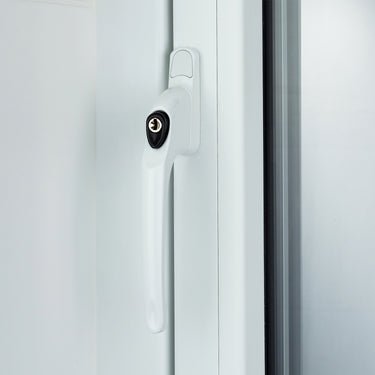 White lockable window handle installed on a uPVC window frame, shown in the closed position with a keyhole in view