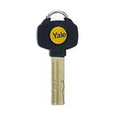 A gold-colored metal key with a black plastic key cap featuring the Yale brand logo in yellow and white.
